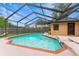 Inviting screened-in pool with brick trim and spacious deck area, perfect for outdoor relaxation and entertainment at 4175 Arrow Ln, Sarasota, FL 34232