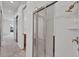 View of a walk-in shower with sliding glass doors, in a bathroom at 5901 Mariposa Ln, Sarasota, FL 34238