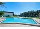 Refreshing community pool with lounge chairs, ideal for relaxation at 3339 Ramblewood Ct, Sarasota, FL 34237