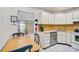 Cozy kitchen with ample counter space and stainless steel appliances at 213 Rubens Dr # D, Nokomis, FL 34275
