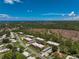 Aerial view of community and surrounding landscape at 213 Rubens Dr # D, Nokomis, FL 34275