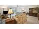 Spacious living room with ample seating and TV at 213 Rubens Dr # D, Nokomis, FL 34275