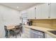 Efficient kitchen, featuring white cabinetry and modern appliances at 213 Rubens Dr # D, Nokomis, FL 34275