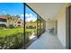 Private screened patio with view of garden at 213 Rubens Dr # D, Nokomis, FL 34275