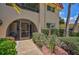 Condo entrance with screened porch and walkway at 213 Rubens Dr # D, Nokomis, FL 34275