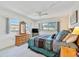 Spacious bedroom with large windows and dresser at 213 Rubens Dr # D, Nokomis, FL 34275