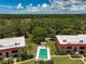 Community overview with pool and lush landscape at 213 Rubens Dr # D, Nokomis, FL 34275