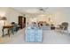 Bright living room features a comfortable seating area and plenty of natural light at 213 Rubens Dr # D, Nokomis, FL 34275