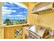 Ocean view outdoor kitchen with stainless steel grill and appliances at 2151 Gulf Of Mexico Dr # 5, Longboat Key, FL 34228