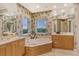 Elegant bathroom with soaking tub and dual vanity at 2151 Gulf Of Mexico Dr # 5, Longboat Key, FL 34228
