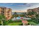 Aerial view of the community pool and oceanfront buildings at 2151 Gulf Of Mexico Dr # 5, Longboat Key, FL 34228