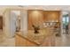 Gourmet kitchen with granite countertops and wood cabinets at 2151 Gulf Of Mexico Dr # 5, Longboat Key, FL 34228