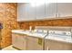 Laundry room with washer, dryer, and cabinets at 2151 Gulf Of Mexico Dr # 5, Longboat Key, FL 34228