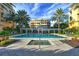 Resort-style pool and spa with surrounding patio and building views at 2151 Gulf Of Mexico Dr # 5, Longboat Key, FL 34228