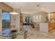 Bright dining area with glass table and ocean view at 2151 Gulf Of Mexico Dr # 5, Longboat Key, FL 34228