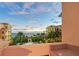 Evening view from balcony overlooking the resort pool and ocean at 2151 Gulf Of Mexico Dr # 5, Longboat Key, FL 34228