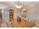 Formal dining room with hardwood floors, wooden table, and adjacent kitchen at 2151 Gulf Of Mexico Dr # 5, Longboat Key, FL 34228