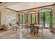 Bright and airy common area features a dining table and ample natural light at 2151 Gulf Of Mexico Dr # 5, Longboat Key, FL 34228
