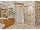 Spa-like bathroom featuring a walk-in shower and modern vanity at 2151 Gulf Of Mexico Dr # 5, Longboat Key, FL 34228