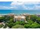 Aerial view of beachfront condo building showcasing its architecture and oceanfront location at 2151 Gulf Of Mexico Dr # 5, Longboat Key, FL 34228