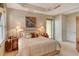 Bright bedroom with king-size bed and access to a private balcony at 2151 Gulf Of Mexico Dr # 5, Longboat Key, FL 34228