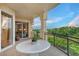 Covered balcony overlooking lush landscaping at 2151 Gulf Of Mexico Dr # 5, Longboat Key, FL 34228