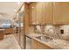 Kitchen boasts stainless steel appliances and granite counters at 2151 Gulf Of Mexico Dr # 5, Longboat Key, FL 34228