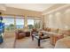 Ocean view living room with comfortable seating and large windows at 2151 Gulf Of Mexico Dr # 5, Longboat Key, FL 34228