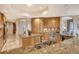 Gourmet kitchen with granite counters and wood cabinets at 2151 Gulf Of Mexico Dr # 5, Longboat Key, FL 34228