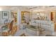 Open concept living area with a glass-top coffee table and hardwood floors at 2151 Gulf Of Mexico Dr # 5, Longboat Key, FL 34228