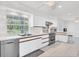 Modern kitchen with stainless steel appliances and white cabinets at 3125 Pickett St, Port Charlotte, FL 33981