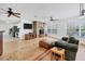 Open living room with hardwood floors, fireplace and built-in entertainment center at 3125 Pickett St, Port Charlotte, FL 33981