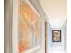 Elegant hallway with large framed artwork and marble flooring at 1111 Ritz Carlton Dr # 1802, Sarasota, FL 34236