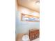 Elegant powder room with unique wall art and decorative storage at 1111 Ritz Carlton Dr # 1802, Sarasota, FL 34236
