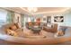Open living area with curved sofa and water views at 1111 Ritz Carlton Dr # 1802, Sarasota, FL 34236