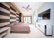 Main bedroom with large bed, TV, and water view at 1111 Ritz Carlton Dr # 1802, Sarasota, FL 34236