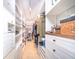 Well-organized walk-in closet with hanging rods and drawers at 1111 Ritz Carlton Dr # 1802, Sarasota, FL 34236