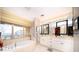 Elegant bathroom featuring double vanity and a soaking tub at 1111 Ritz Carlton Dr # 1802, Sarasota, FL 34236