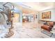 Elegant entryway with marble floors and modern sculpture at 1111 Ritz Carlton Dr # 1802, Sarasota, FL 34236