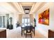 Formal dining room with a spacious table and chairs, large artwork, and city views at 1111 Ritz Carlton Dr # 1802, Sarasota, FL 34236