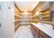 Elegant powder room, marble flooring and striped walls at 1111 Ritz Carlton Dr # 1802, Sarasota, FL 34236