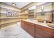Modern bathroom with striped wallpaper and marble flooring at 1111 Ritz Carlton Dr # 1802, Sarasota, FL 34236