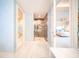 Spa-like bathroom with glass shower and access to bedroom at 1111 Ritz Carlton Dr # 1802, Sarasota, FL 34236