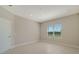 Well-lit bedroom featuring a window and tile floors at 14631 Barefoot Ln, Parrish, FL 34219