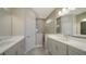 Modern bathroom with double vanity and walk-in shower at 14631 Barefoot Ln, Parrish, FL 34219