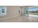Living room with sliding doors to a screened patio at 14631 Barefoot Ln, Parrish, FL 34219