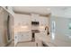 Modern kitchen with white cabinets and quartz countertops at 14631 Barefoot Ln, Parrish, FL 34219