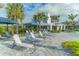 Relaxing pool deck with lounge chairs and umbrellas at 14631 Barefoot Ln, Parrish, FL 34219