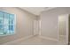 Bedroom with window, closet, and tile flooring at 14631 Barefoot Ln, Parrish, FL 34219