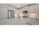 Modern kitchen with white cabinets and quartz countertops at 14631 Barefoot Ln, Parrish, FL 34219